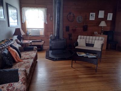 Living Room. With a cozy woodstove for winter visitors!